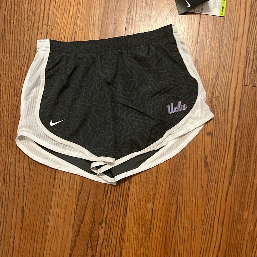 Nike Black Athletic Shorts with Curved Side Panels and Iconic Logo